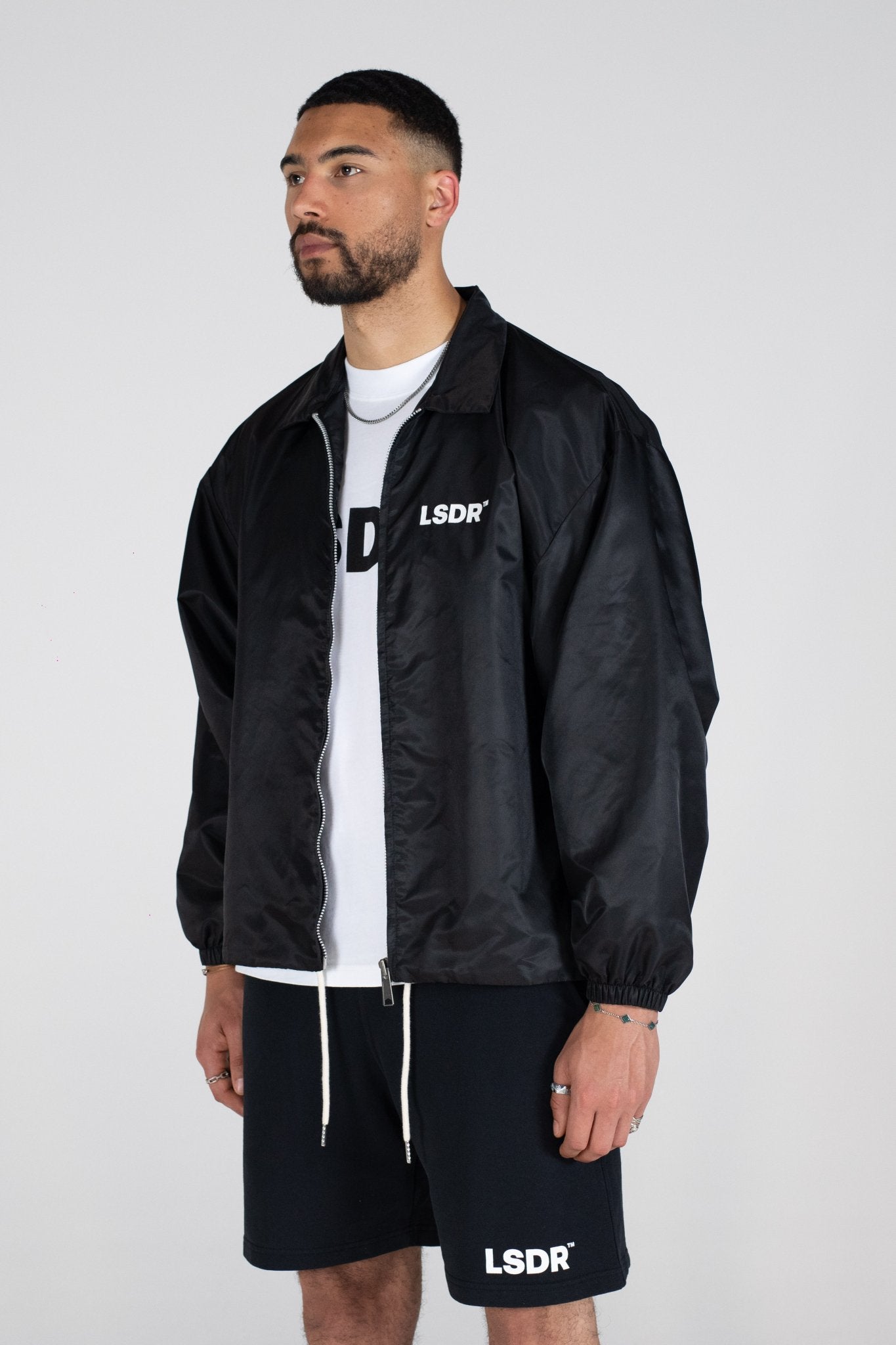 COACH JACKET LSDR - COACH JACKET LA SCENE DE RUE - OVERSIZED SUMMER JACKET LSDR - NYLON JACKET BLACK STREETWEAR OVERSIZED - FEAR OF GOD JACKET - OVERSIZED JACKET WITH COLLAR - OVERSIZED LOGO JACKET - REPRESENT COACH JACKET - POLYESTER JACKET STEETWEAR BLACK WHITE - JACKET WITH CORDS YKK ZIPPER